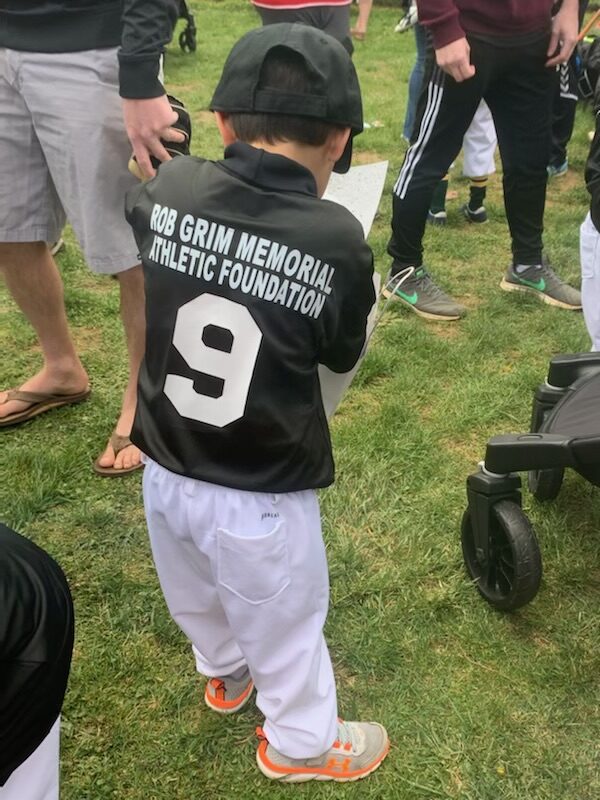 A toddler wearing the number nine jersey